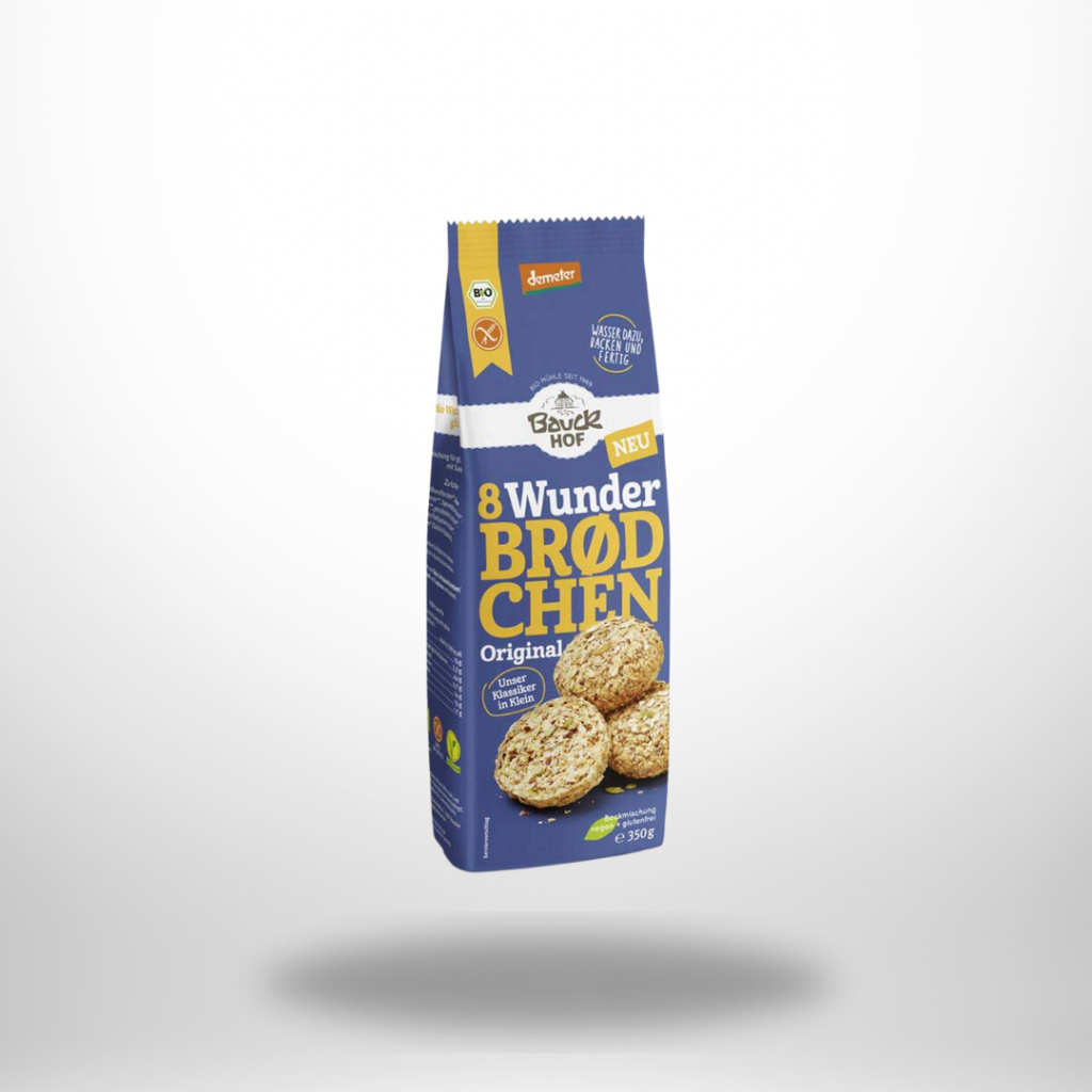 Packshot der Bauck Mühle 8 Wunder‑Brötchen Hafer: blau-grüne Papierverpackung mit dem Bauck‑Logo und Abbildung von drei golden gebackenen Hafer‑Brötchen auf der Vorderseite.